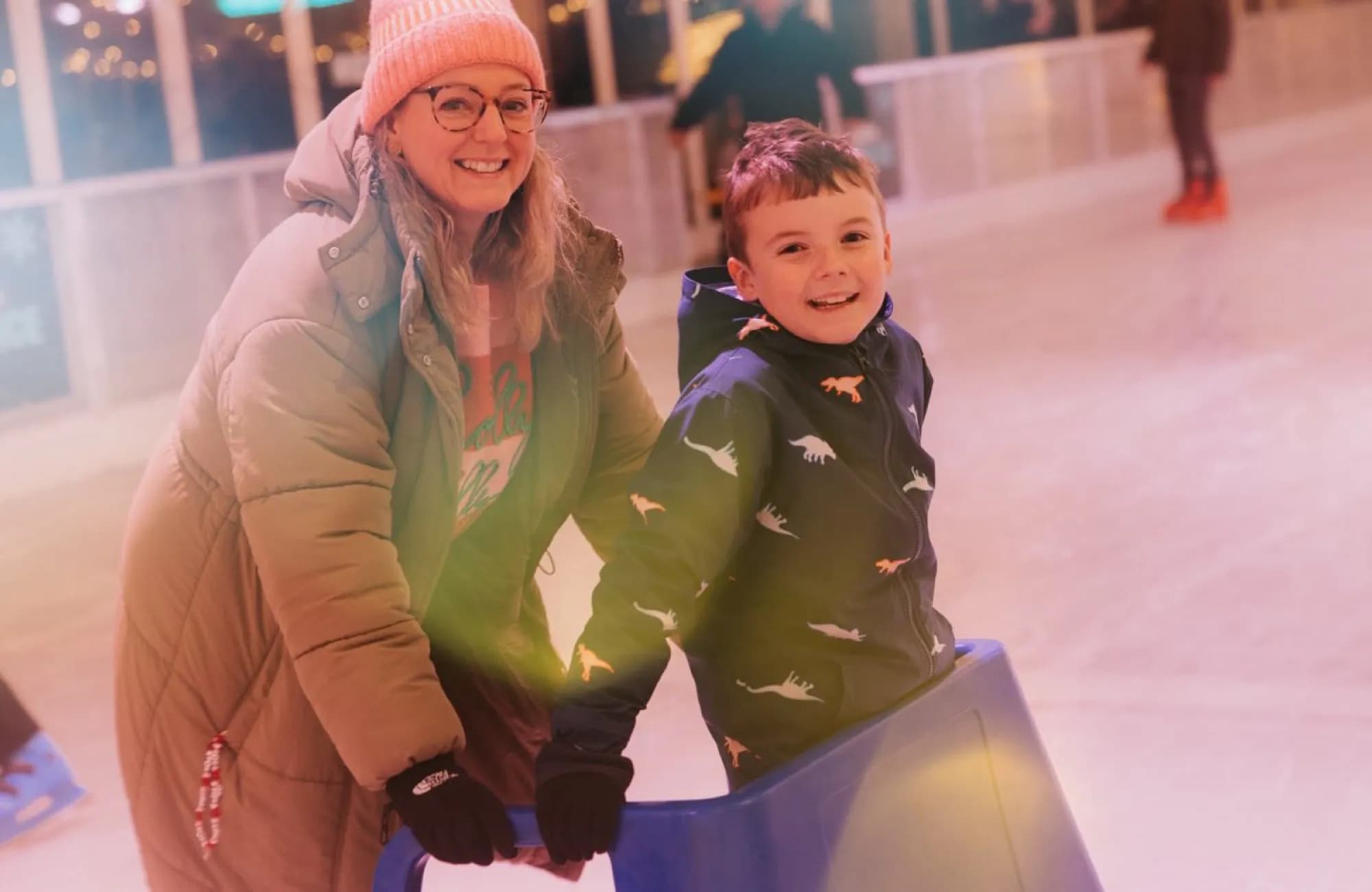 A mother and son skating together