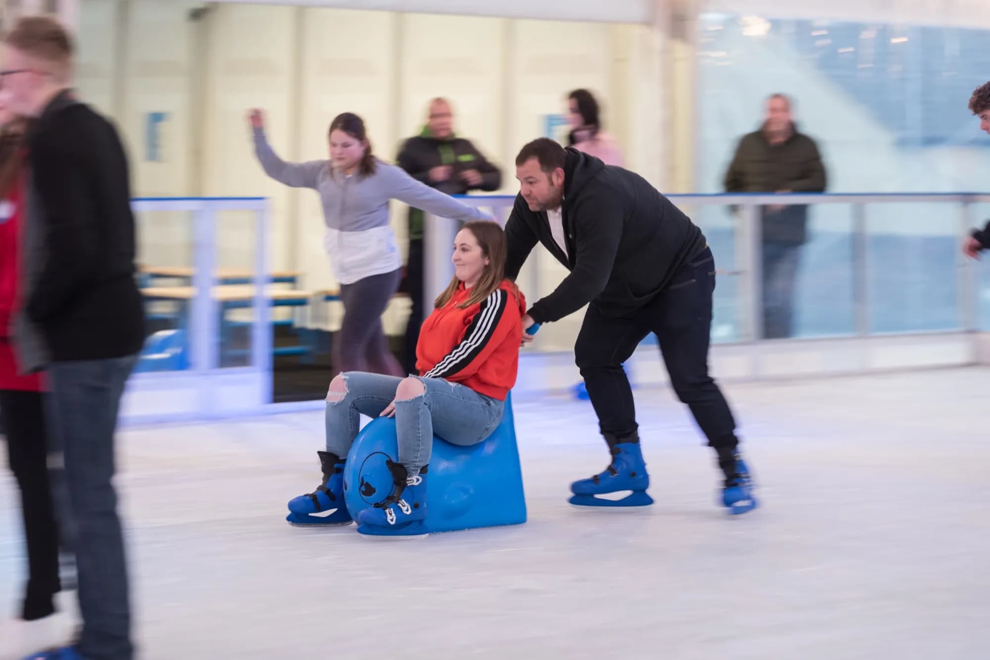 A child skating with a skating aid