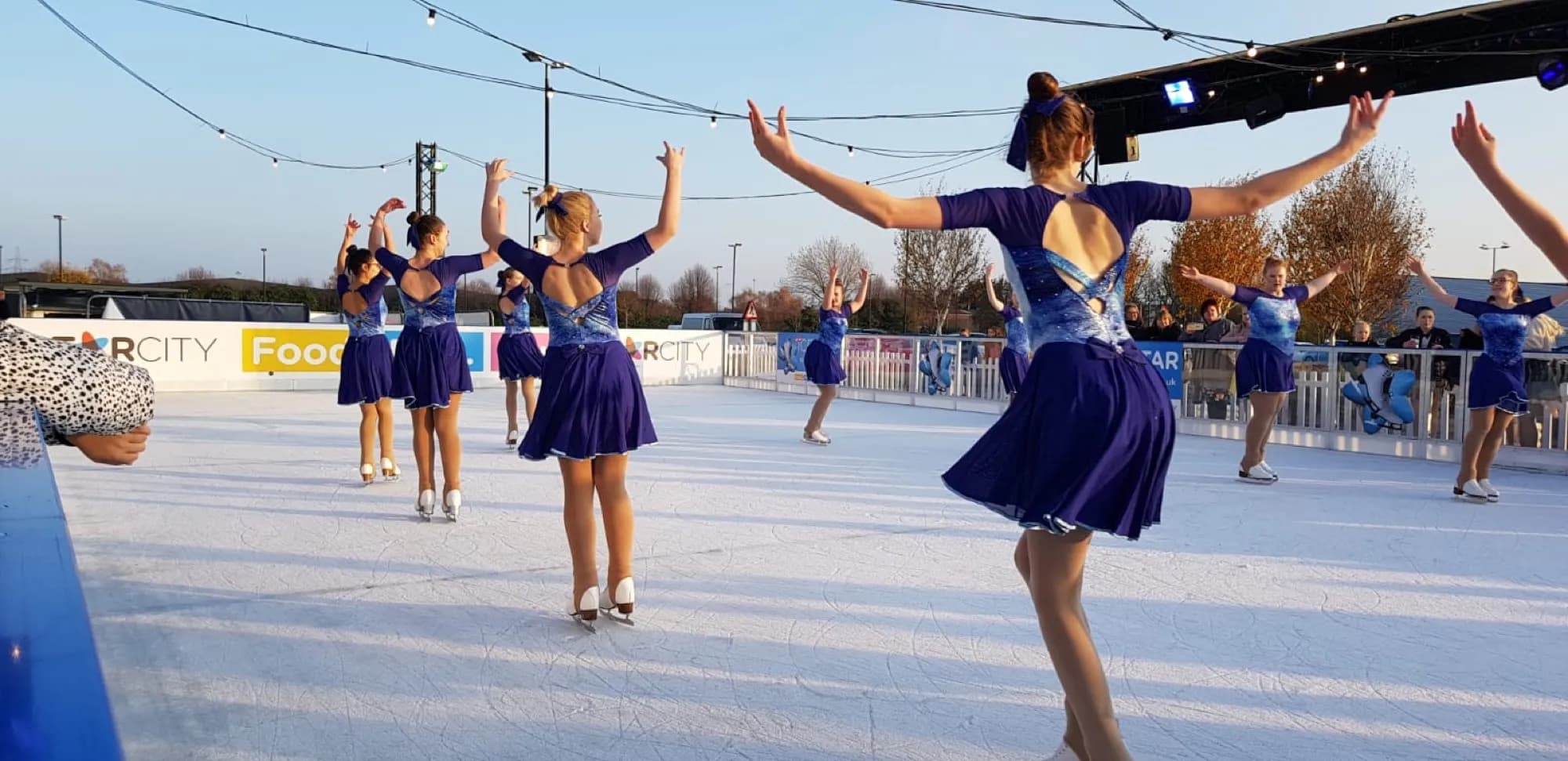 A figure skater performing at the StarCity outdoor rink